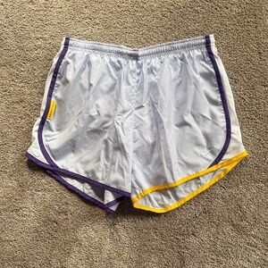 Nike Girl’s White Athletic Shorts with Purple and Yellow Trim